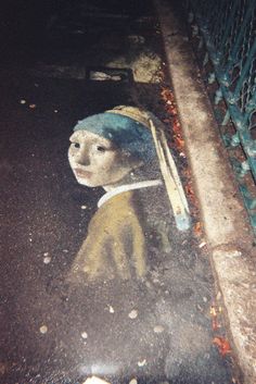 Artist Adam Wellborn draws a chalk portrayal of Johannes Vermeer's 